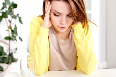 Why-are-my-Ears-Ringing_woman-suffering-from-headache-CVKRDE2