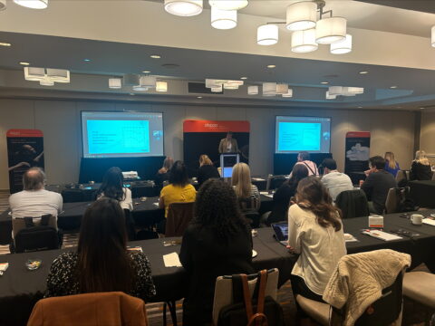 People seated looking at screen